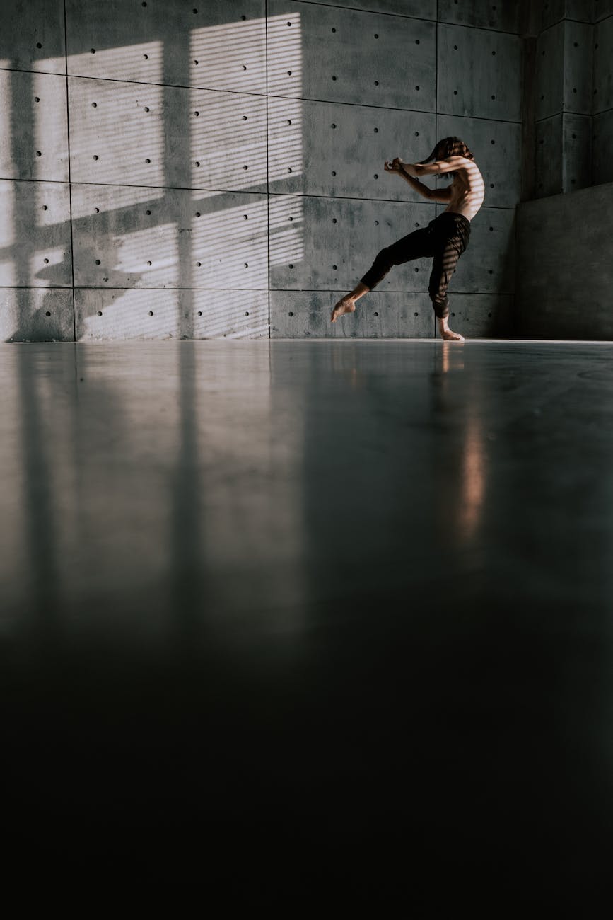 a man practicing contemporary dance inside the studio